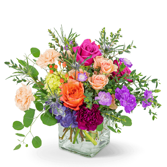 Kaleidoscope Dream is the perfect birthday or anniversary gift. Let us help make their day with this special flower delivery! The rich tones of this arrangement will add a pop of color to any space. It features Hydrangea, Roses, Carnations, and other premium foliage. 
