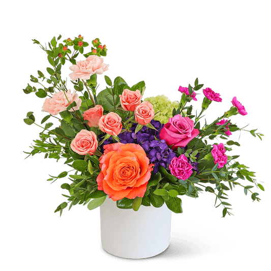 Prismatic Promise is the perfect birthday or romantic gift. Let us help make their day with this special flower design! If you want us to deliver flowers, but want something extraordinary, we suggest Prismatic Promise. It features beautiful roses, hydrangeas, carnations, and other premium foliage that will add a pop of color to any space.