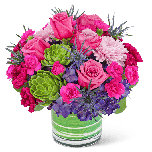 Delight in the rich purple tones of one of our floral favorites, London Luxe with Succulents. A chic, leaf-lined vase with hydrangea, roses, carnations, succulents, and premium foliage makes up this lavish floral design. This vibrant flower arrangement will brighten anyone's day and add a pop of color to any space. It would make a perfect Anniversary or Birthday gift for that special someone.